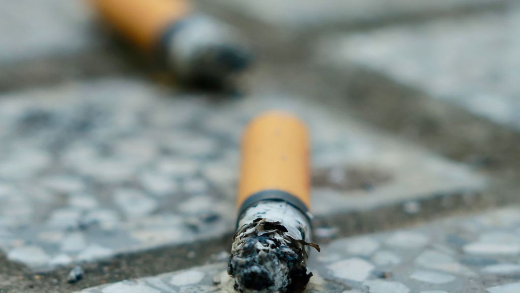Cigarette ends littered on the ground