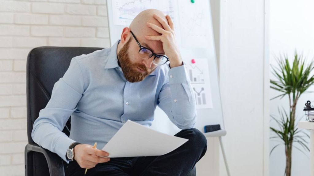 Employee reading a document in the office