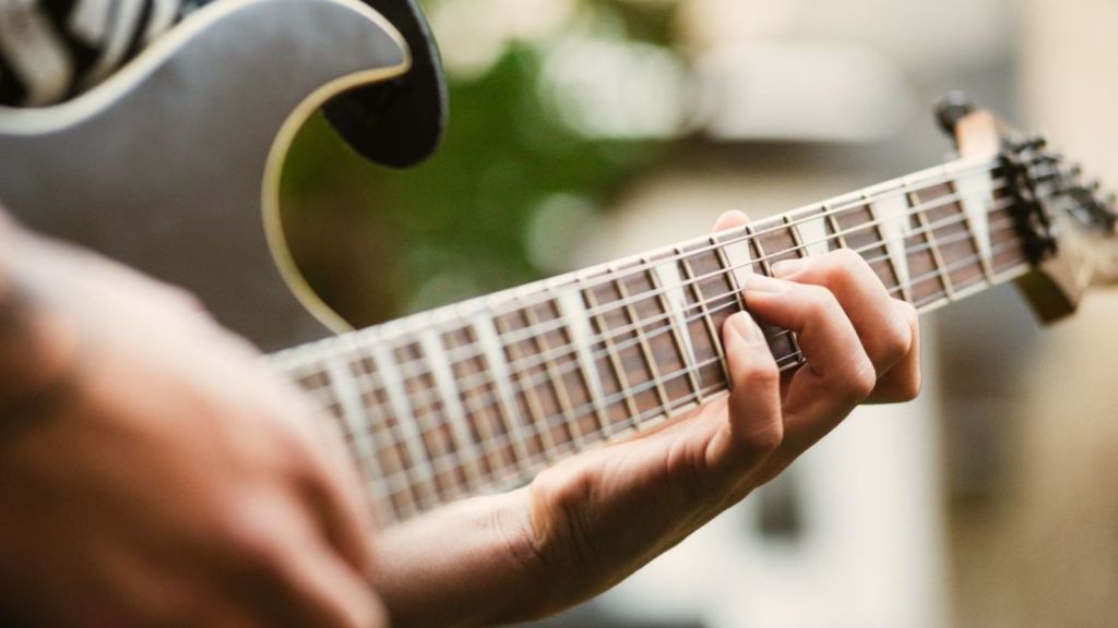 Person playing the guitar