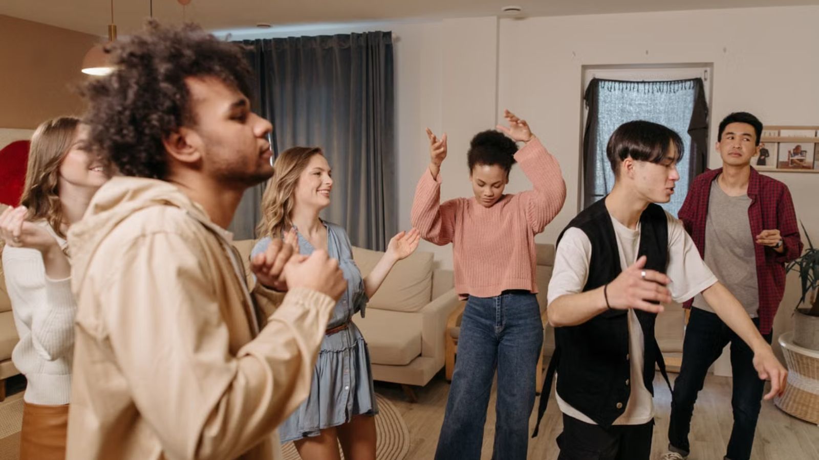 She Keeps Getting Sensory Overload at Her Boyfriends House — So She Asked Him to Compromise or Shed Stop Coming Over Adults having a dance party indoors