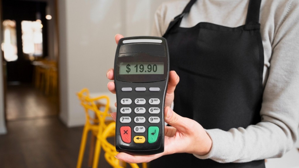 Person paying using nfc technology