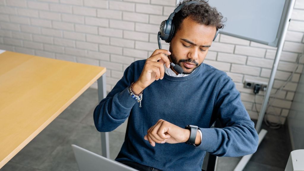 Man in blue sweater at work