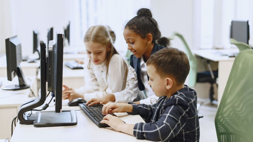 Three kids at a computer