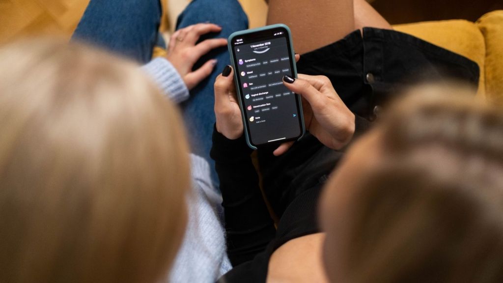 Two women looking at smartphone