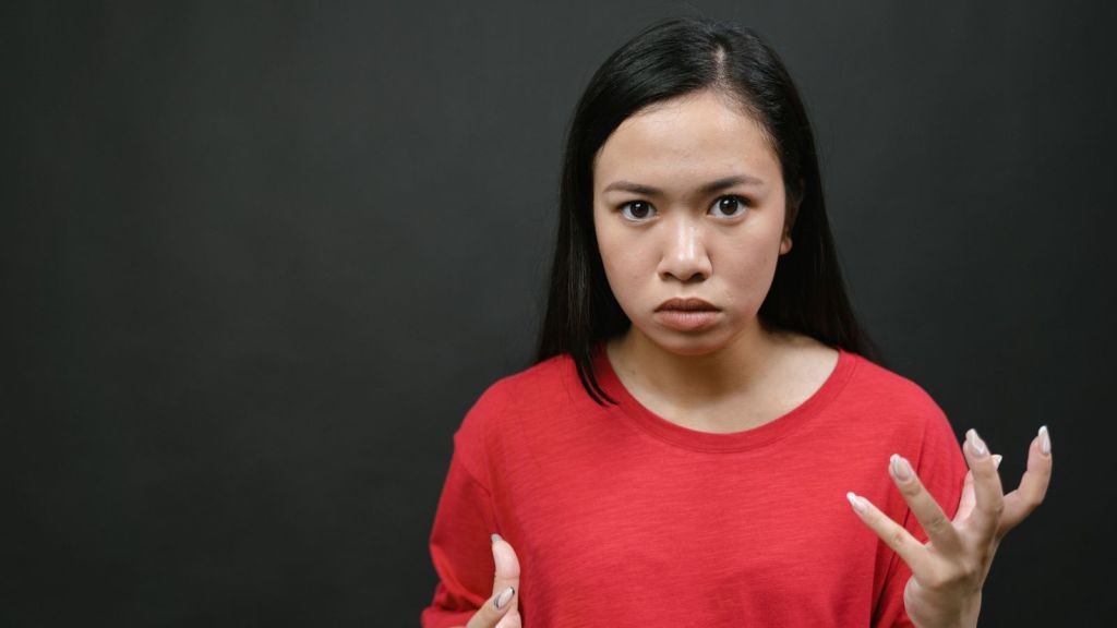 Angry woman in red shirt