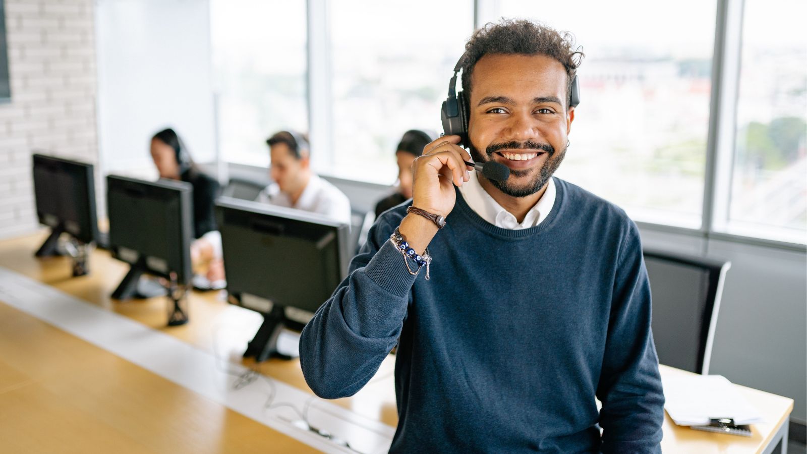 Man in blue sweater at work