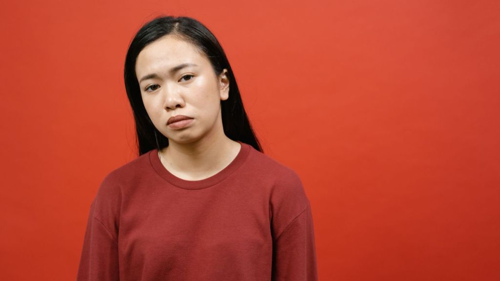 Sad woman in red tshirt