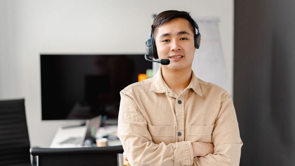 Man in brown shirt working