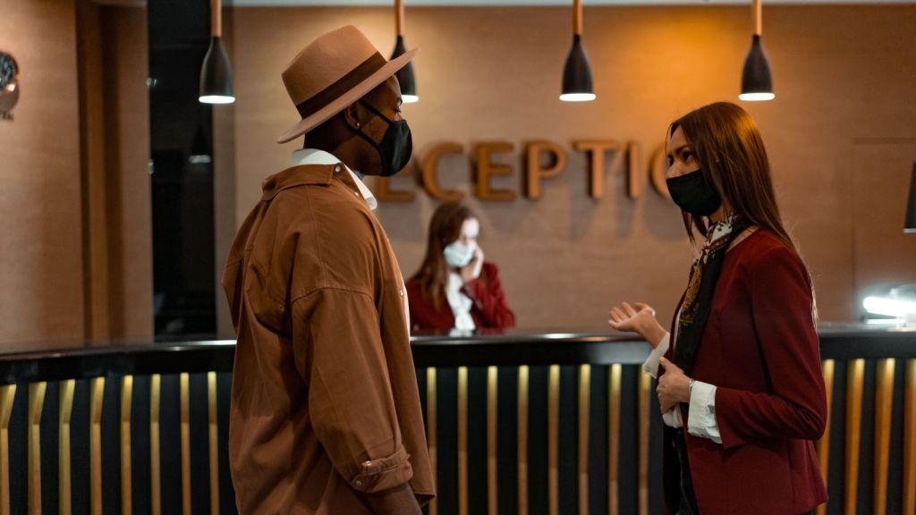 man and woman at front desk