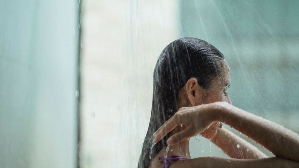 Woman showering in the bathroom