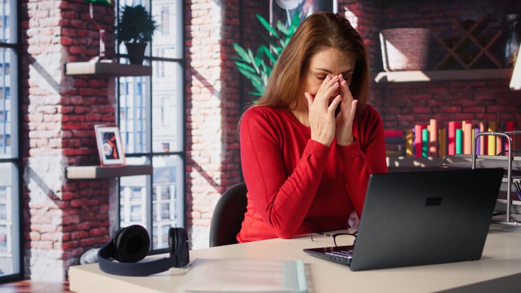 Woman silently crying in the office