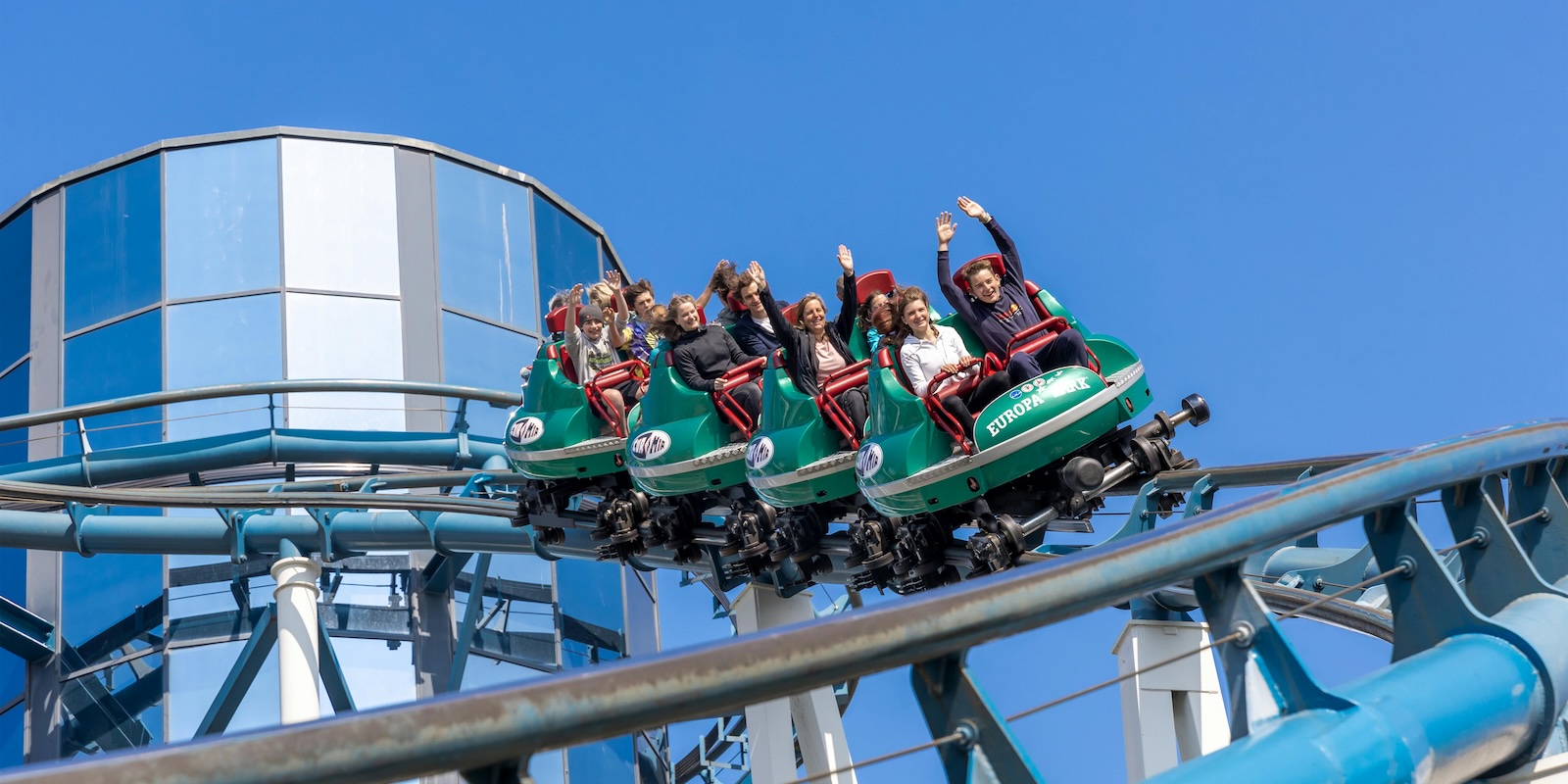 Woman Doesn’t Want to Return to Her Favorite Amusement Park Because Her Friend Can No Longer Ride Most Attractions people riding a roller coaster at an amusement park