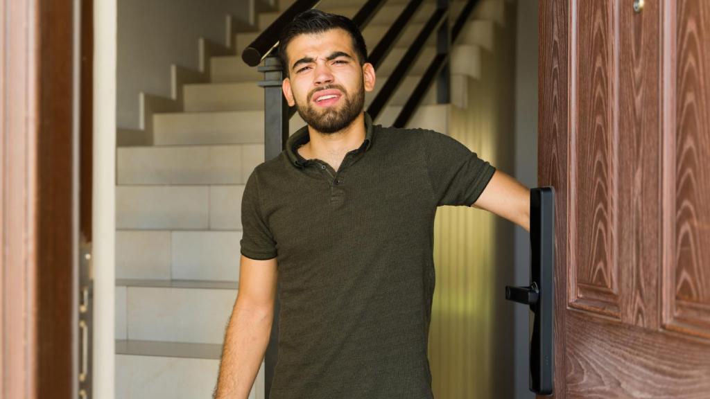man opening a door