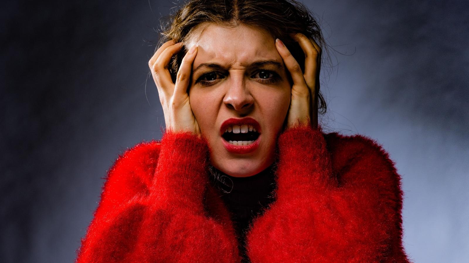 angry woman in red sweater