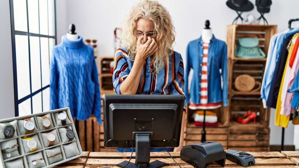 annoyed and tired female cashier