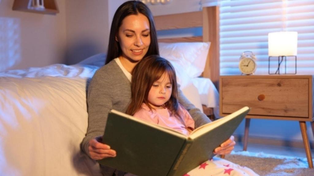 Babysitter reading bedtime story