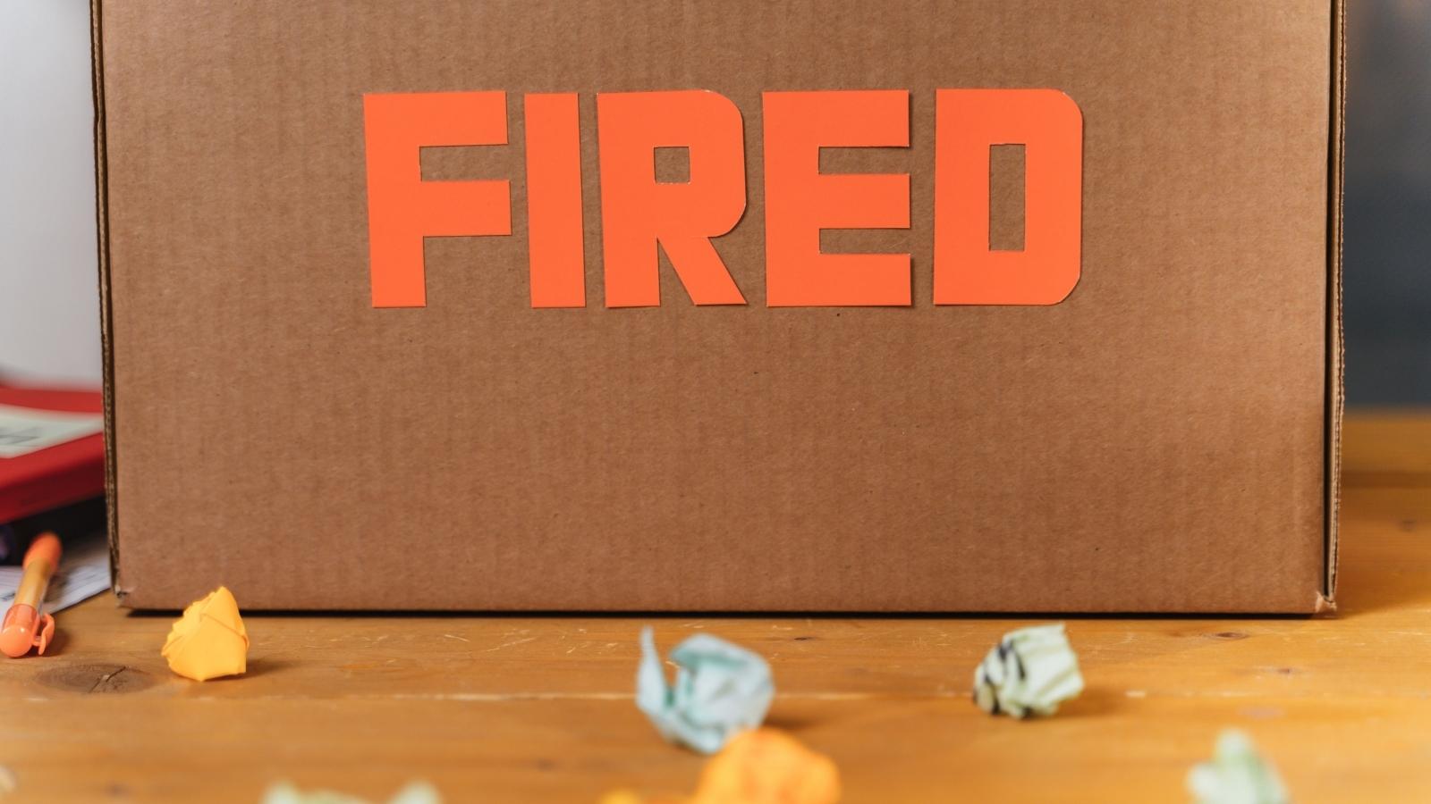 Caught in the Crossfire: Woman Fears Furious Backlash From Friend Who Doesnt Know Shes Fired cardboard box that says fired