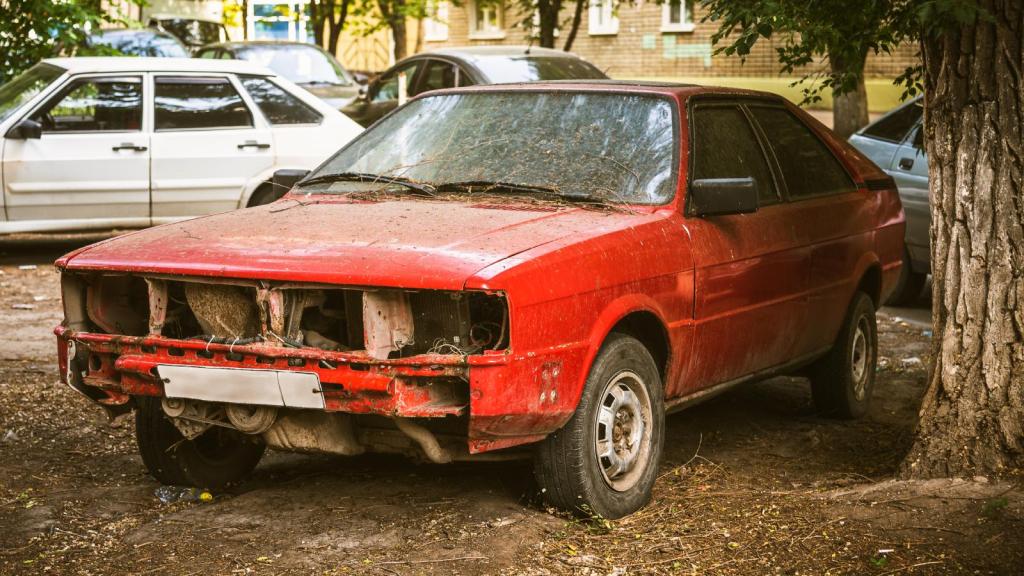 junk car in a yard