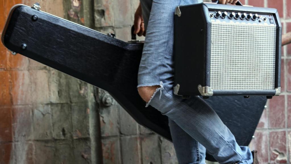 man holding music equipment