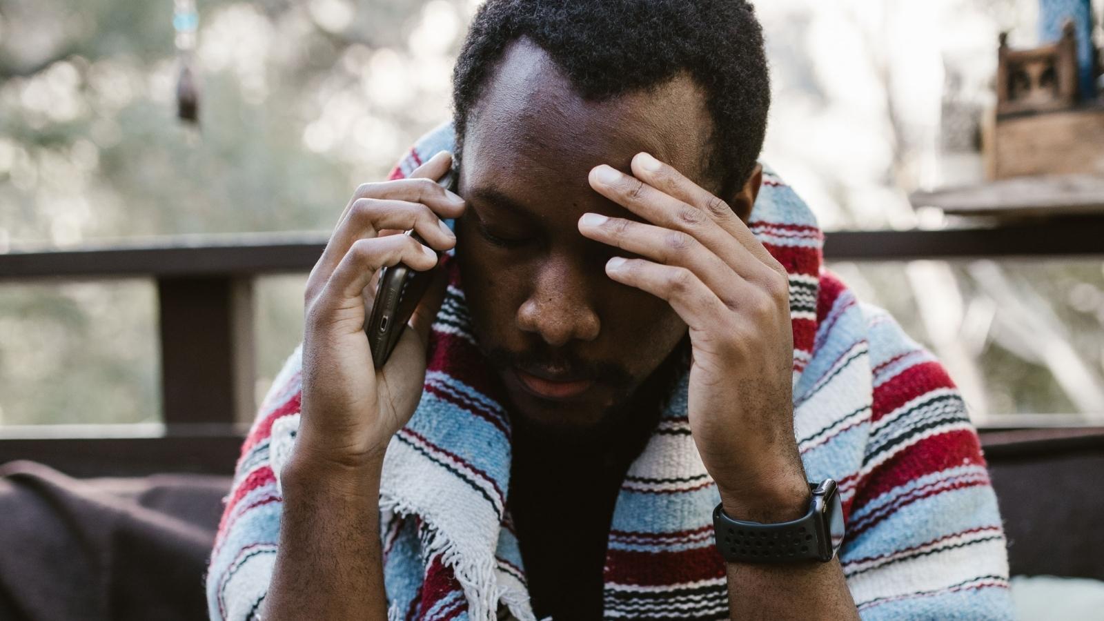 concerned man talking on the phone