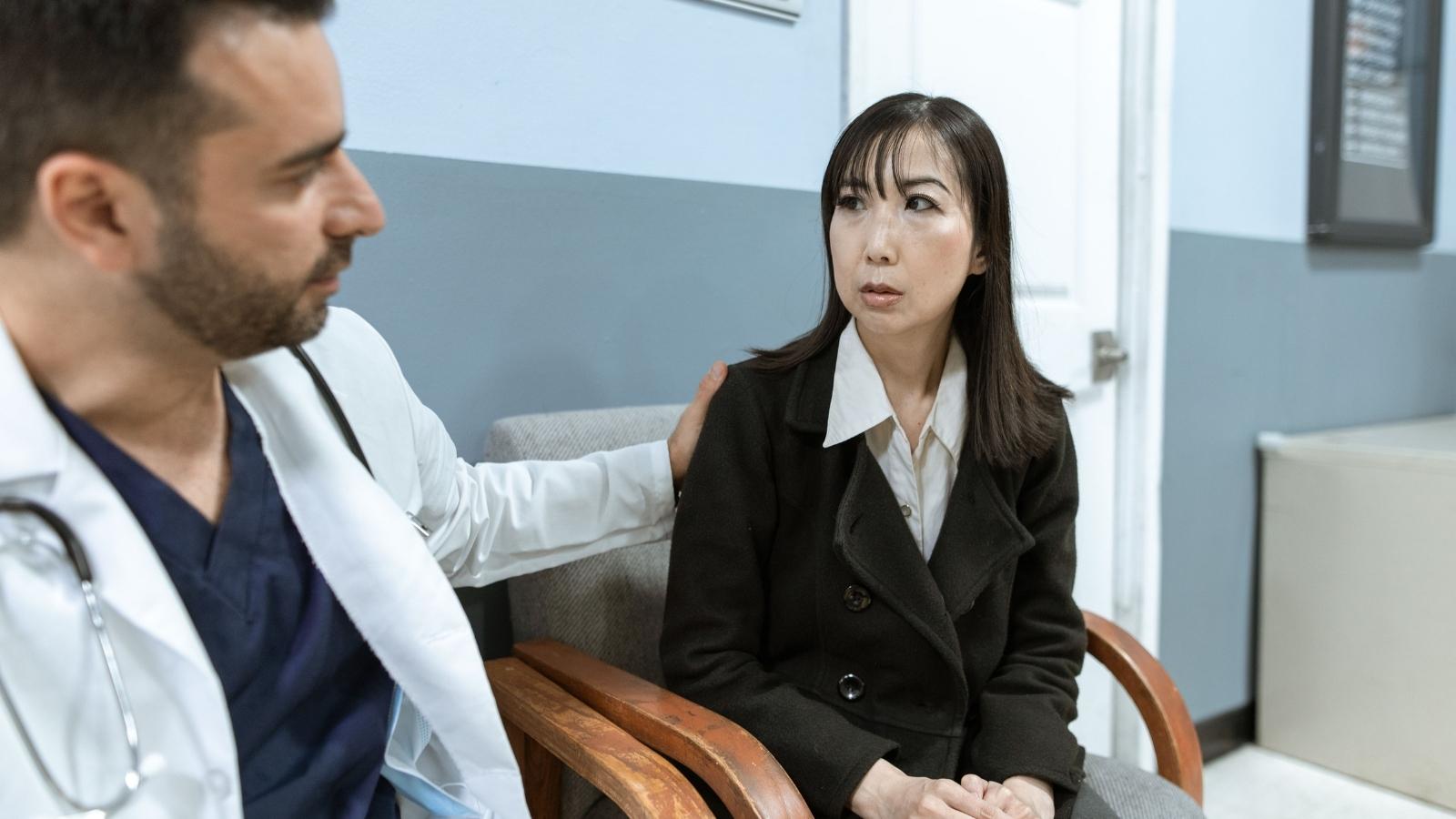 A Woman Is Asked To Become Legal Guardian Of Her Schizophrenic Older Brother, And She Questions Whether She’s Ready For The Responsibility doctor comforting a professional woman