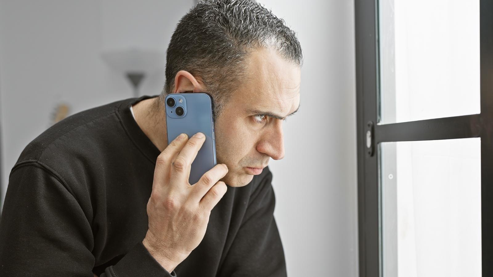 A Neighborhood Dispute Escalates After One Homeowner Decides to Take Action man on a phone call