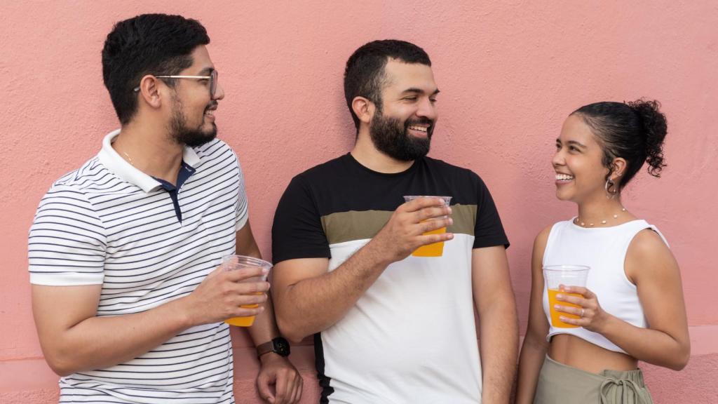 three people having a conversation