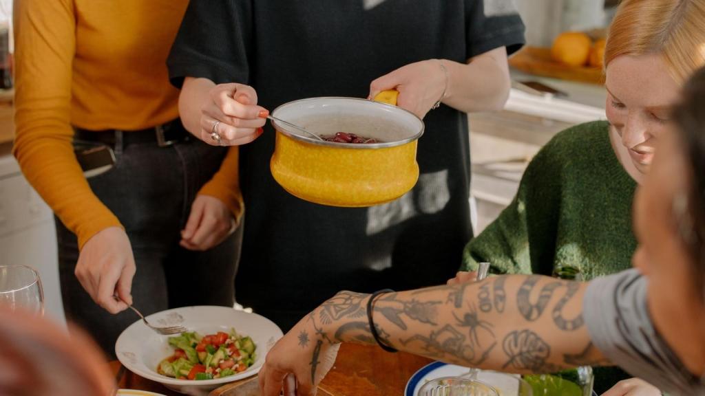 friends bringing dishes to a potluck