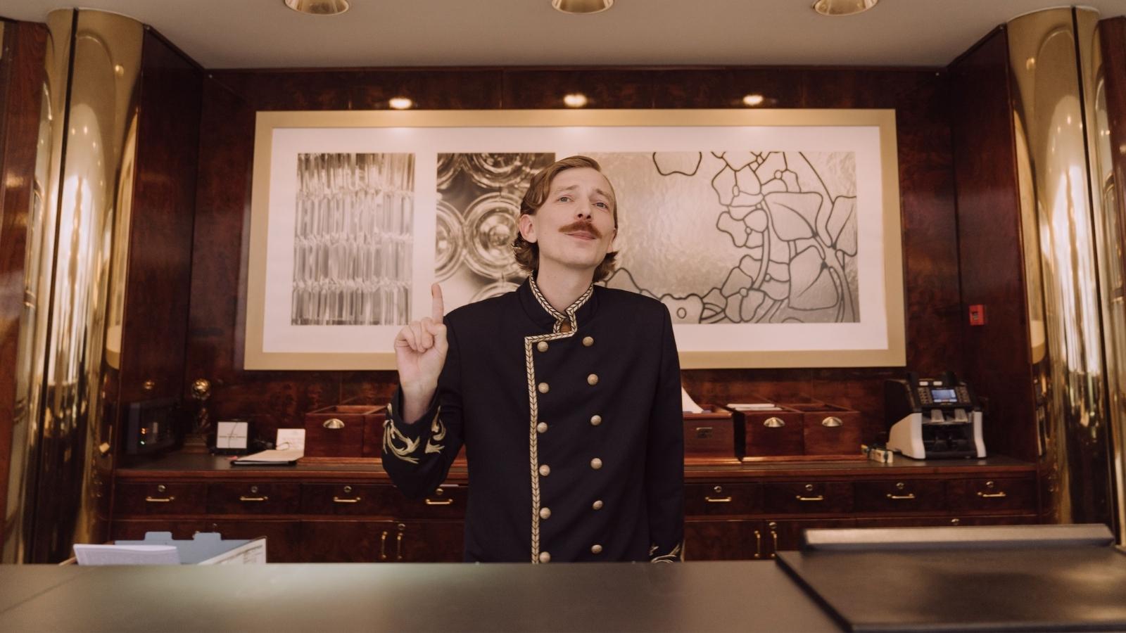 Frustrated Hotel Worker Argues With Customer Who Refuses to Follow the Rules front desk employee at hotel