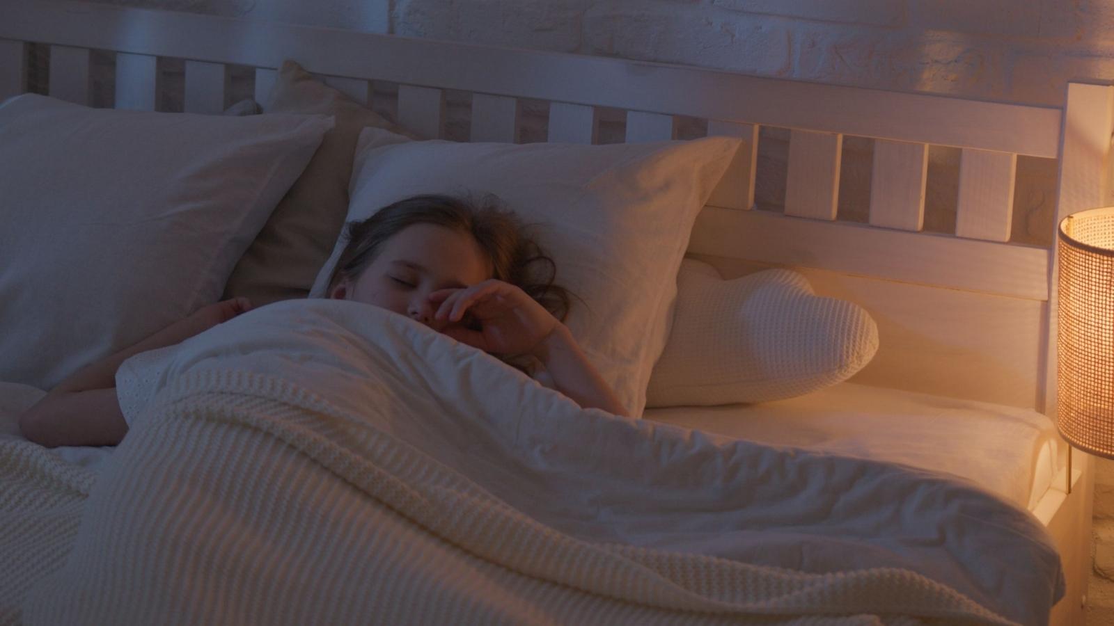 Teen Pushes Back After Mom Expects Her to Share Sleeping Space With Younger Siblings girl asleep in bed