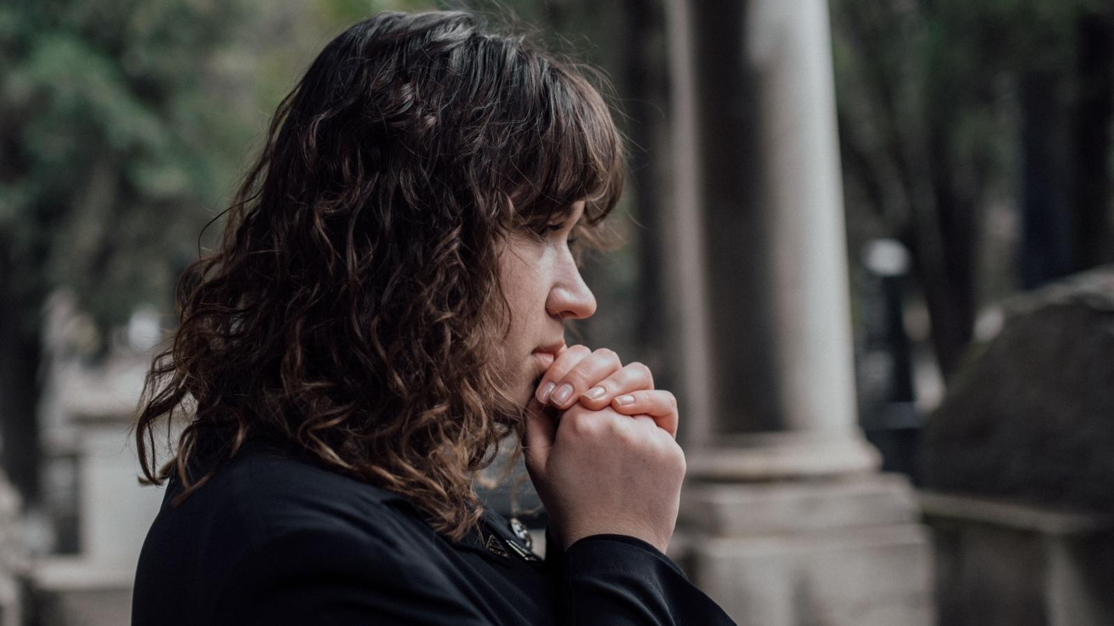 grieving woman wearing black