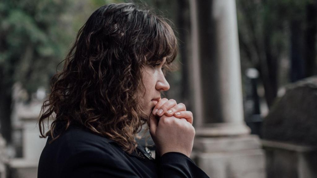grieving woman wearing black