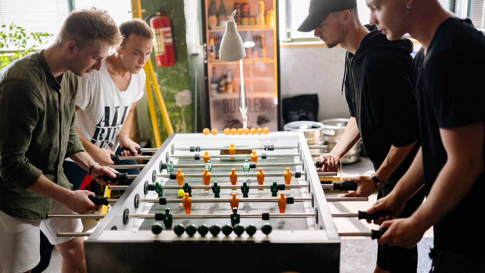 Youve Known Her 2 Months: Bachelor Party Guests Honest Warning Blows Up the Whole Trip group of men playing foosball