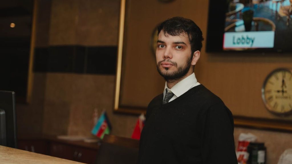 hotel employee at reception table