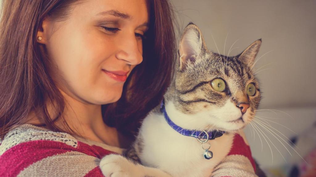 woman holding a cat