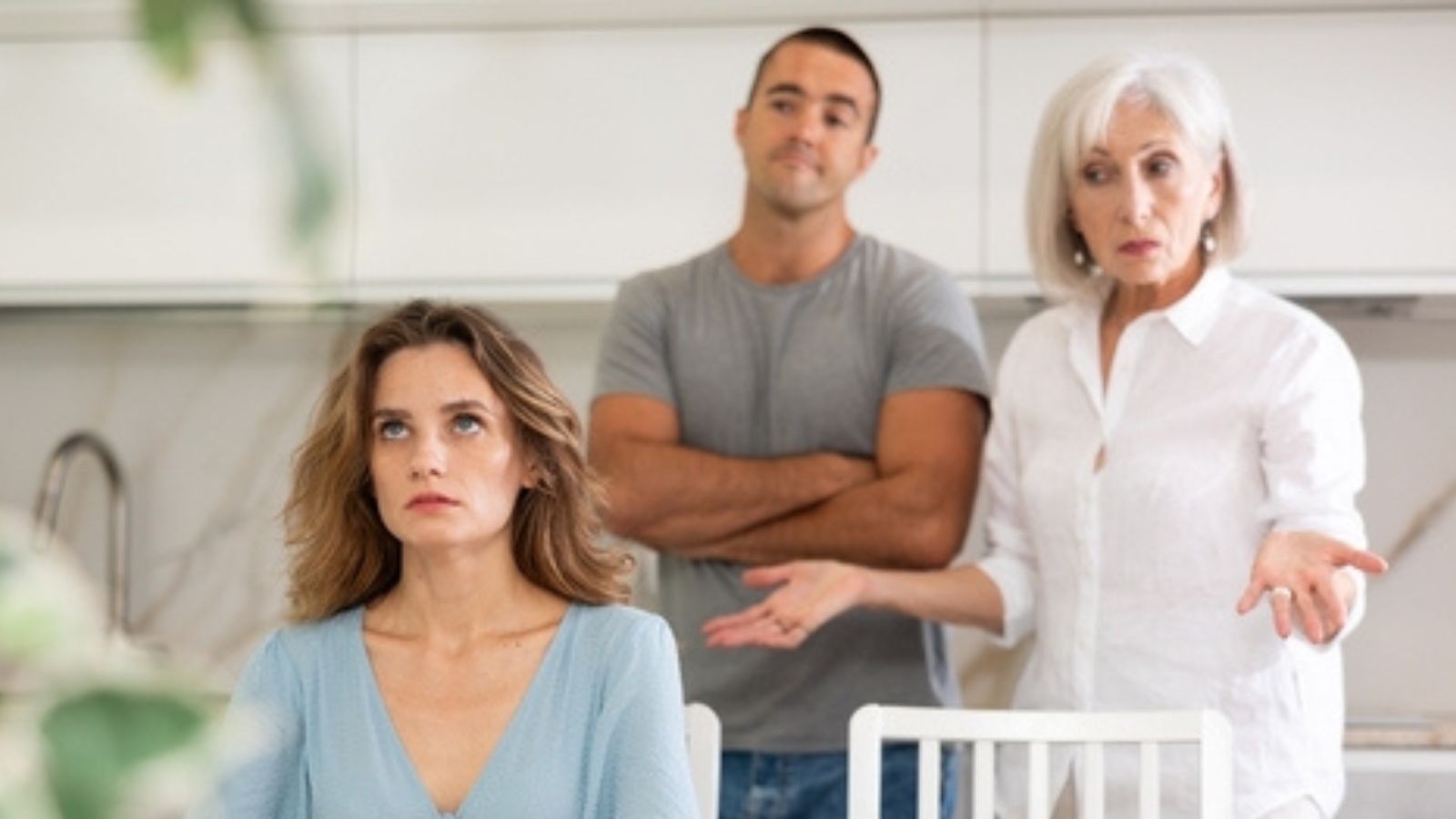 Woman Pushes Back Against Unannounced Mother in Law Visit, but Is Told She Overreacted Upset mother with family