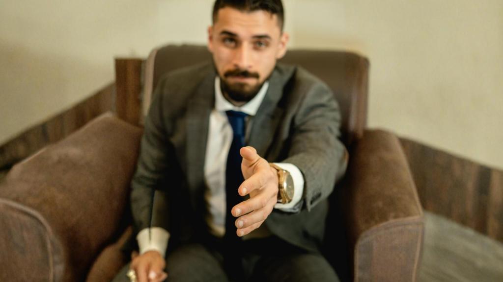 man extending hand for a handshake