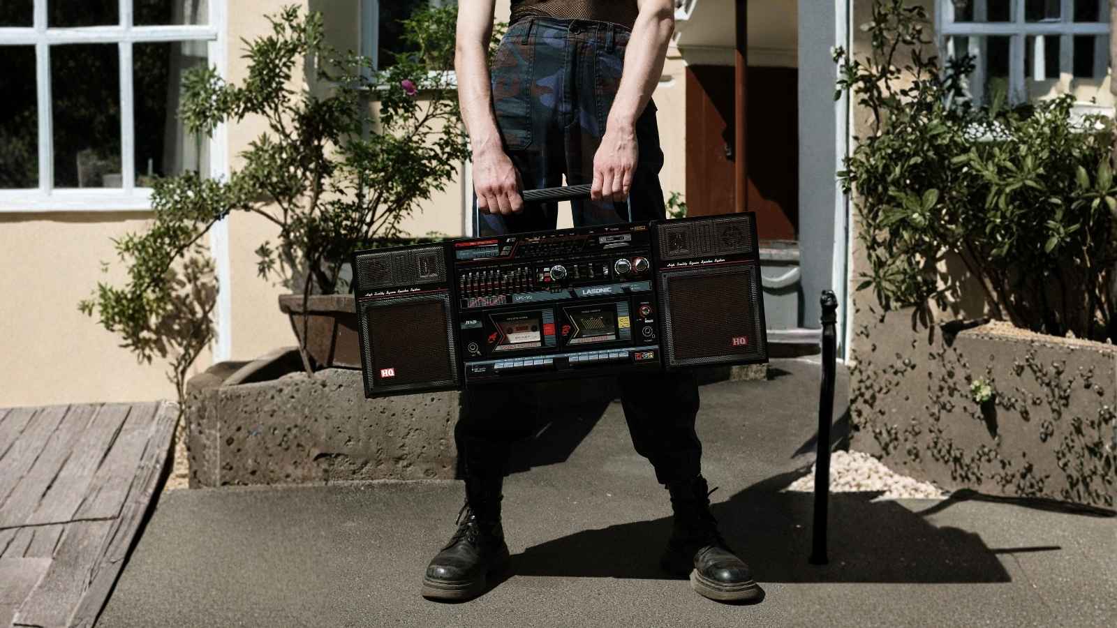 man holding a large boombox