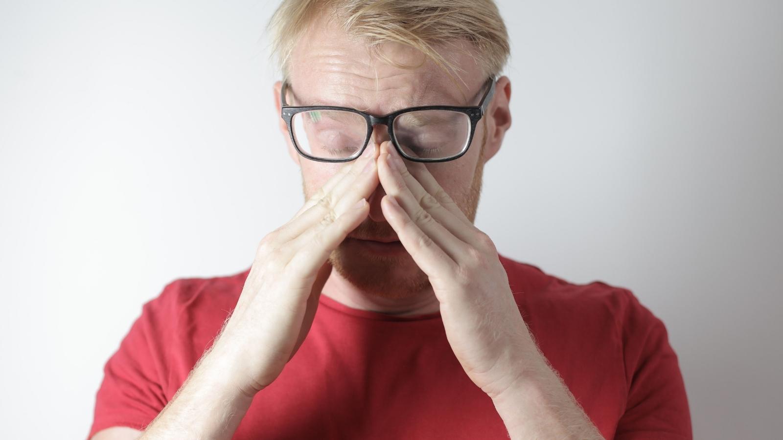 Man Is Tired Of Hearing About His Friend’s Mooching Ex—And Wants To Finally Say Something man in red shirt frustrated