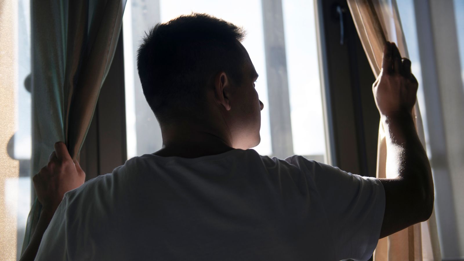 man looking through the window