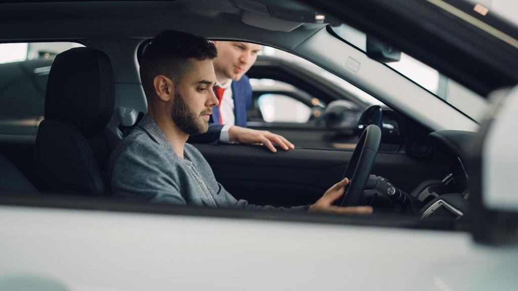 man testing out a new car at the car dealership