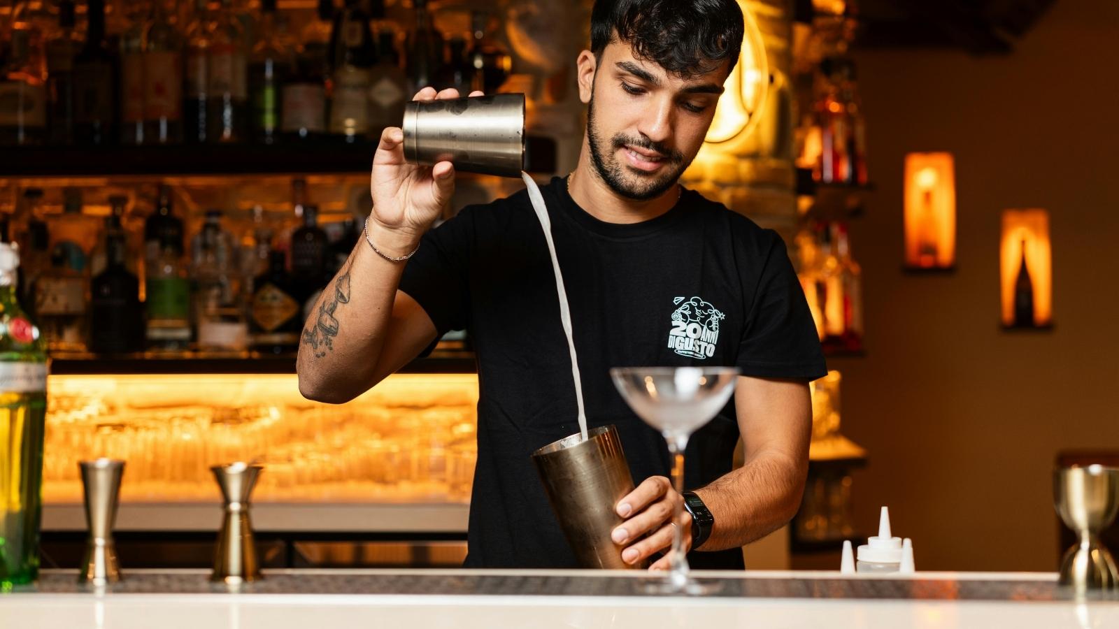 man working at a bar