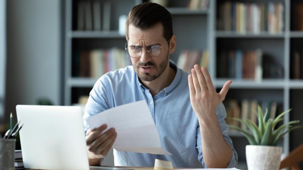man looking at a document