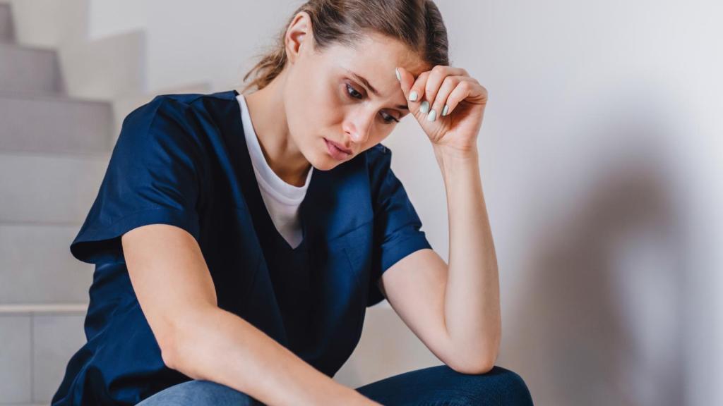 nurse sitting on some stairs