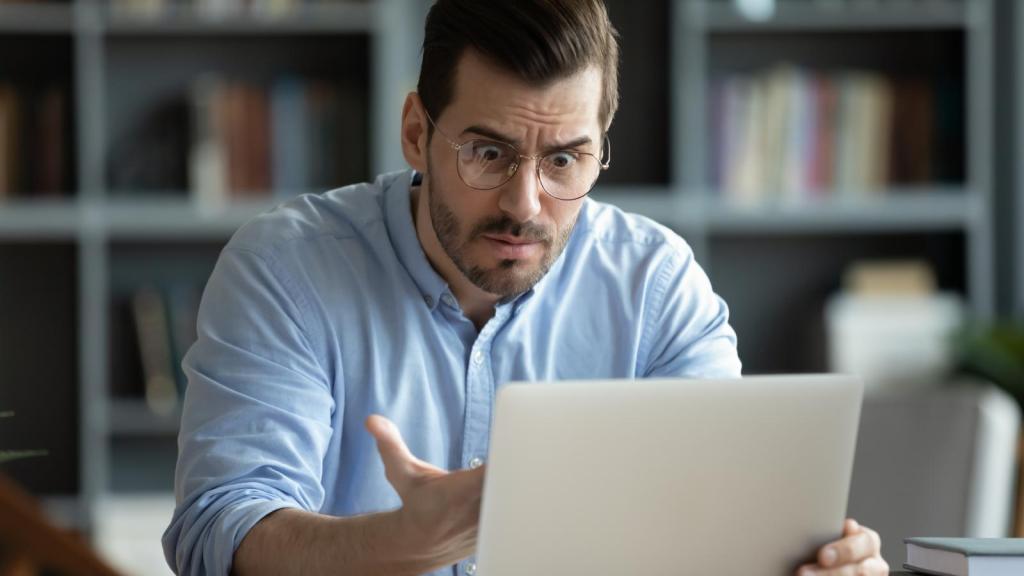 man looking at a computer
