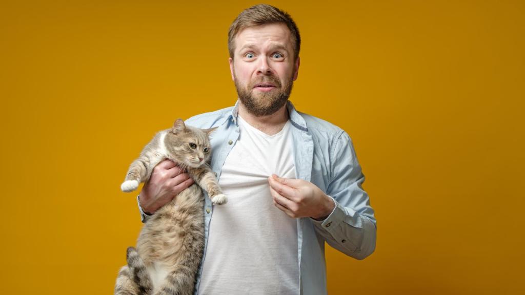 man holding a cat