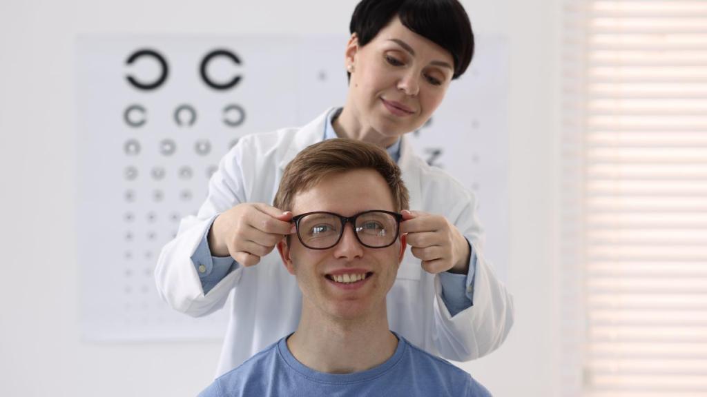 man trying on glasses