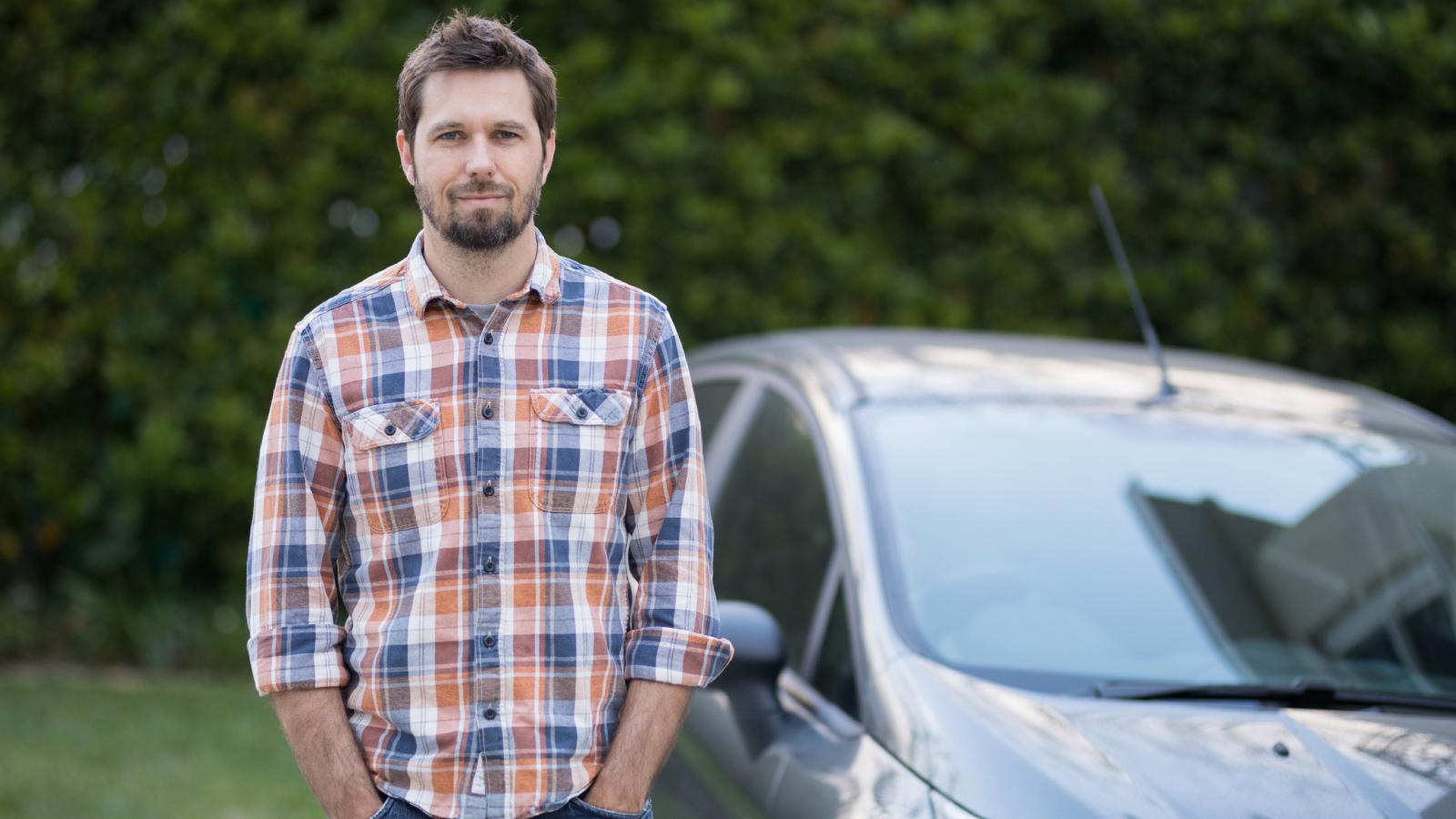 man in front of a car