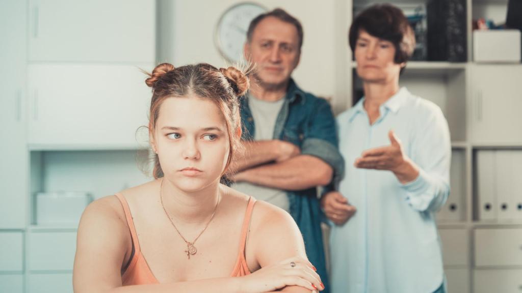 girl ignoring her parents