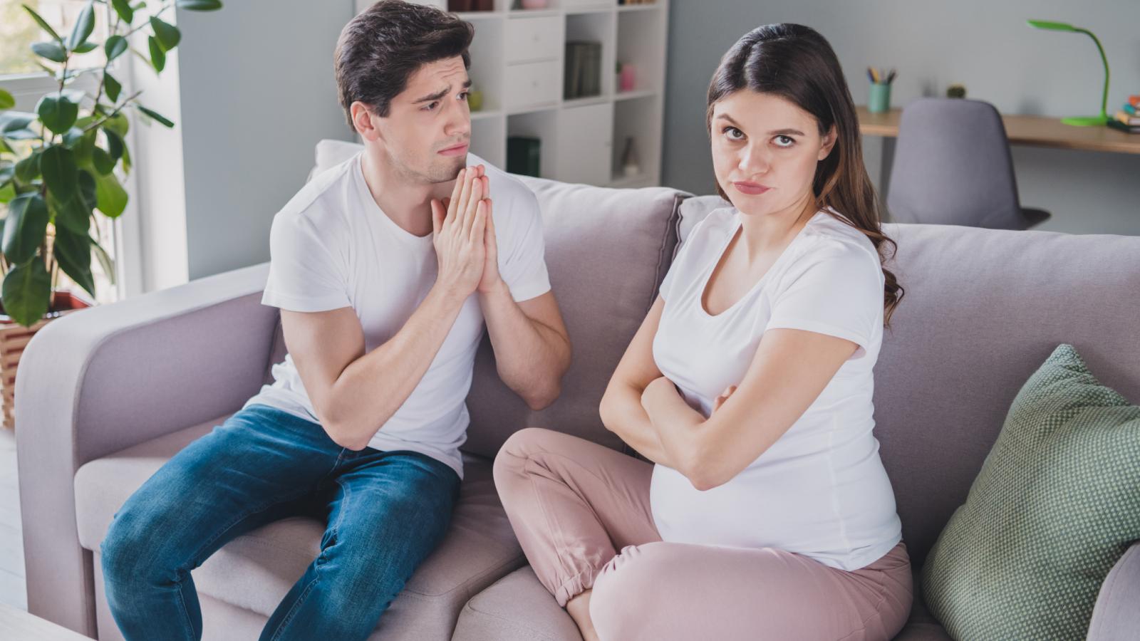 Woman Frustrated When Husband Won’t Stop Talking During Pregnancy Baby Care Class pregnant woman with a man